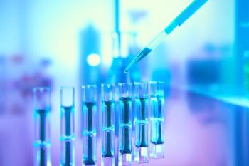 Scientific background in vibrant neon colors, purple, blue and turquoise. Pharma, biotech, protein analysis. Spectrophotometer quvettes on a reflective surface, copy-space., focus on pipette tip. | Image Credit: © tilialucida - stock.adobe.com