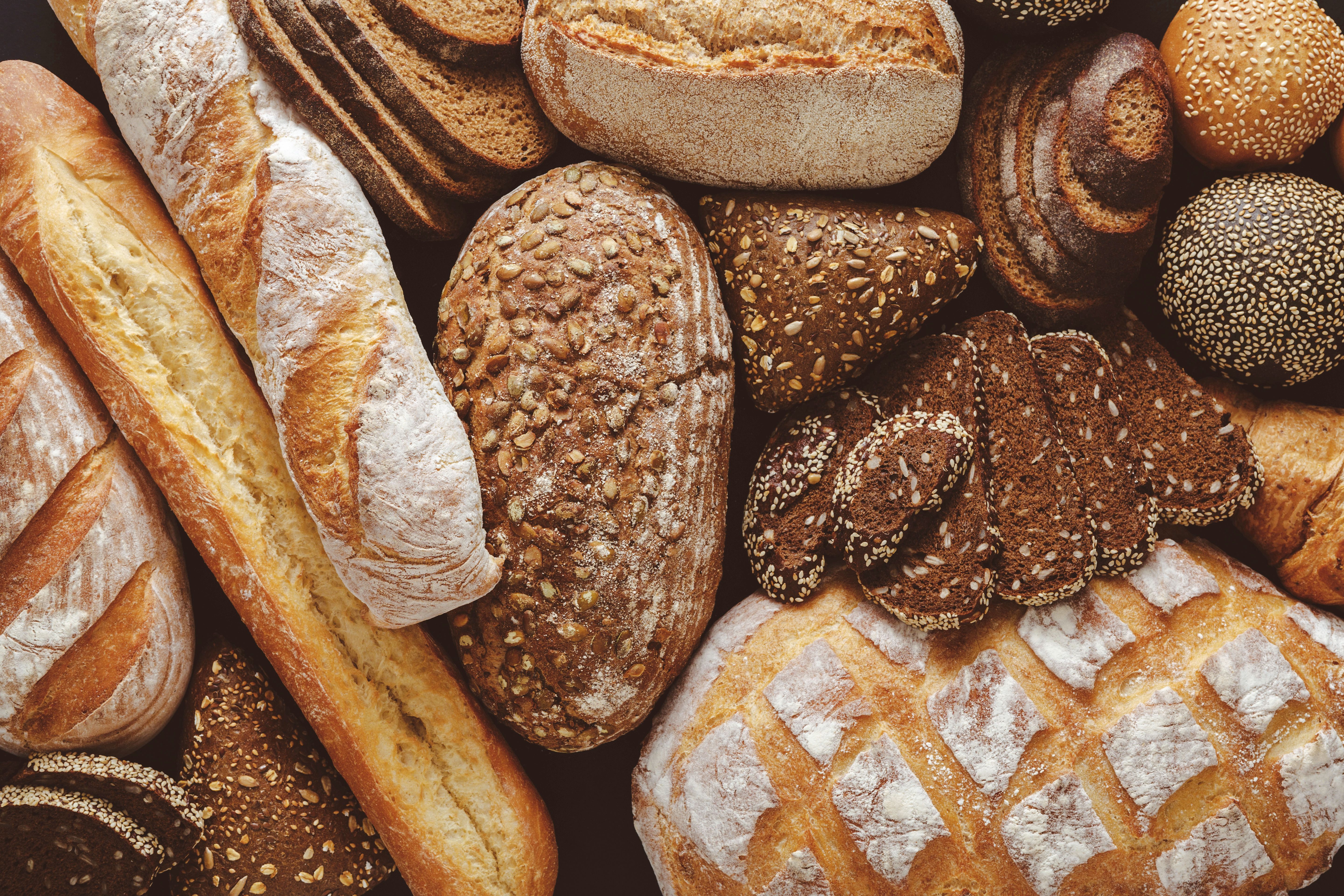 Bread background, top view of white, black and rye loaves | Image Credit: © Prostock-studio - stock.adobe.com