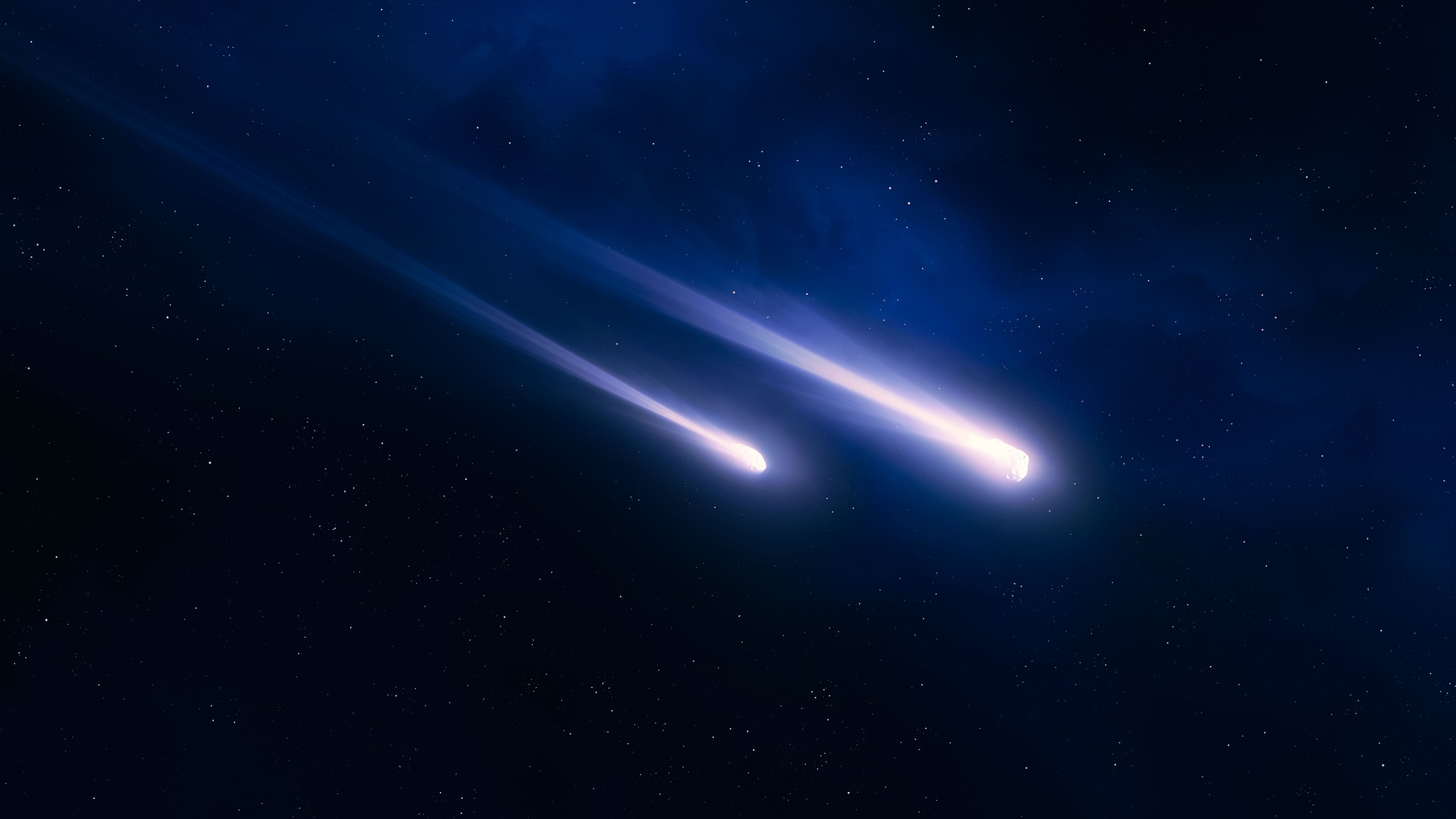 Meteorites with luminous tails. Comets light up the night sky. Fireballs on a black background. Falling stars isolated. | Image Credit: © Nazarii - stock.adobe.com