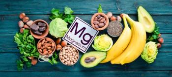 Foods containing natural magnesium. Mg: Chocolate, banana, cocoa, nuts, avocados, broccoli, almonds. Top view. On a blue wooden background. | Image Credit: © Yaruniv-Studio - stock.adobe.com