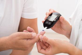 Doctor Using Glucometer On Patient's Finger | Image Credit: © Andrey Popov - stock.adobe.com
