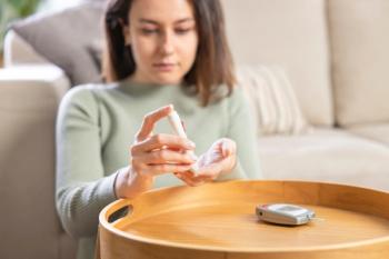 Young woman doing blood sugar test at home | Image Credit: © dragonstock - stock.adobe.com