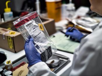 A forensic police officer examines a smartphone as evidence in a murder case at a forensic laboratory | Image Credit: © digicomphoto - stock.adobe.com