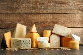 Different kinds of delicious cheese on table | Image Credit: © Africa Studio - stock.adobe.com