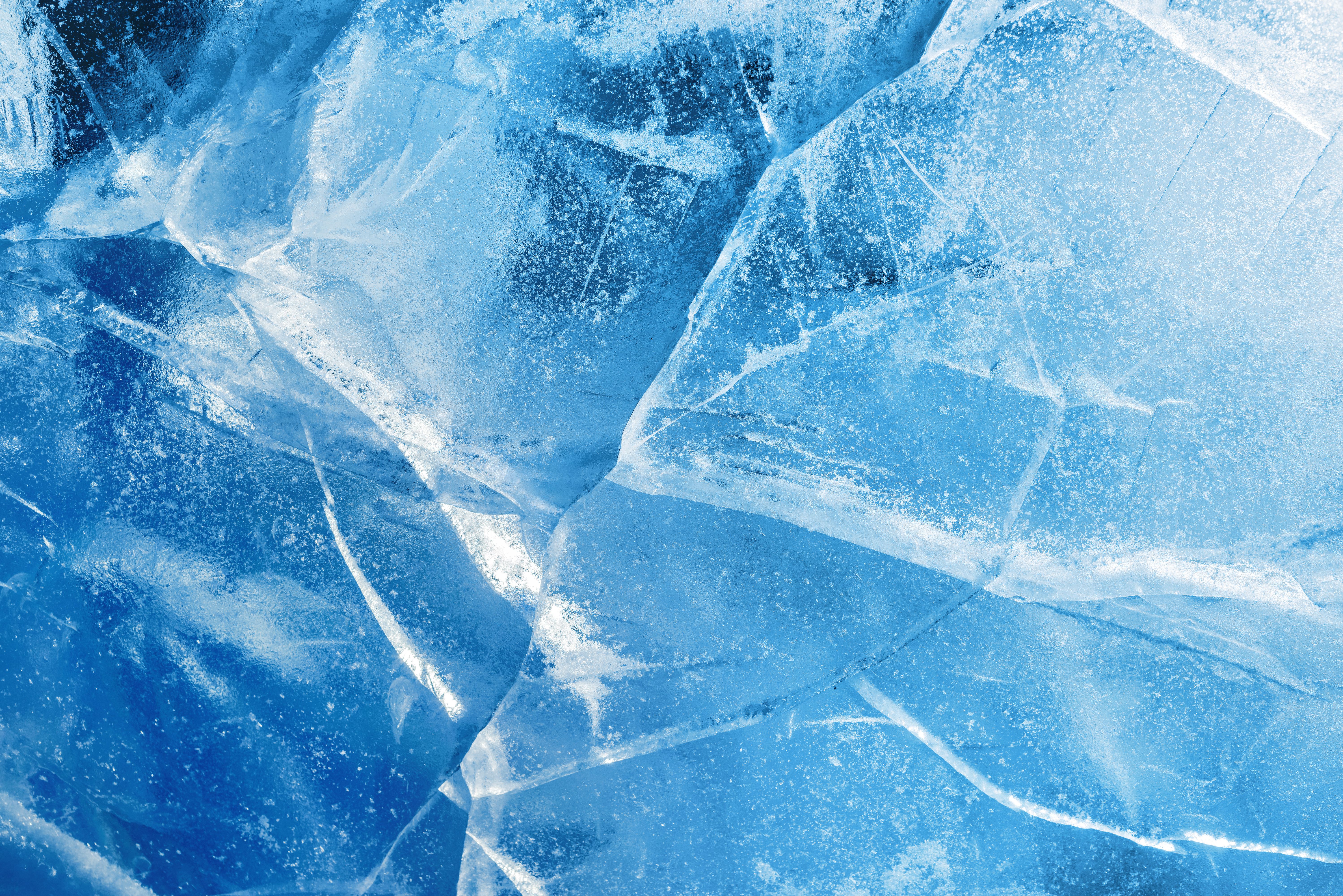Abstract ice background. Blue background with cracks on the ice surface | Image Credit: © Leonid Akin - stock.adobe.com