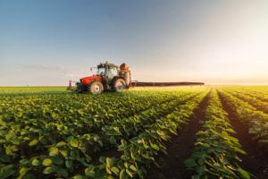 farm tractor plowing a field