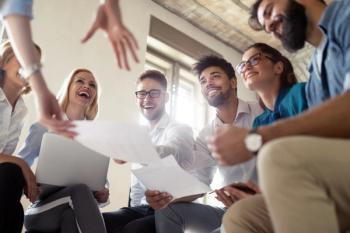 Successful happy group of people learning in person | Image Credit: © NDABCREATIVITY - stock.adobe.com