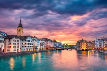 Cityscape image of Zurich, Switzerland during dramatic sunset. | Image Credit: © rudi1976 - stock.adobe.com