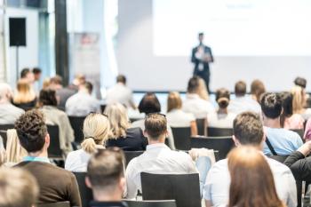 Male Business Speaker Giving A Talk At Business Conference Event. | Image Credit: © John - stock.adobe.com