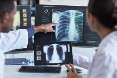 Clinical diagnosis and collaboration. Ideal for healthcare technology, radiology, and/or AI diagnostics marketing | Image Credit: © DragonImages - stock.adobe.com