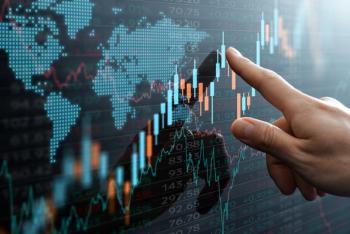 Graphs and world financial markets data. Investor pointing at the candlestick chart. | Image Credit: © tadamichi - stock.adobe.com.