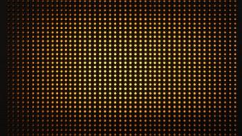 A glowing yellow and orange LED matrix creates a vibrant, illuminated digital grid pattern. Generated by AI. | Image Credit: © Jeannaa - stock.adobe.com