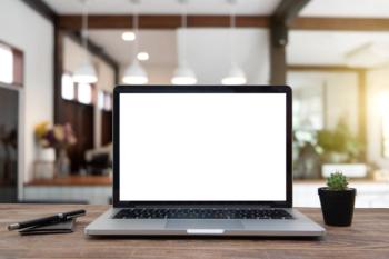 Desk Laptop with blank screen on table of coffee | Image Credit: © RAYBON - stock.adobe.com.