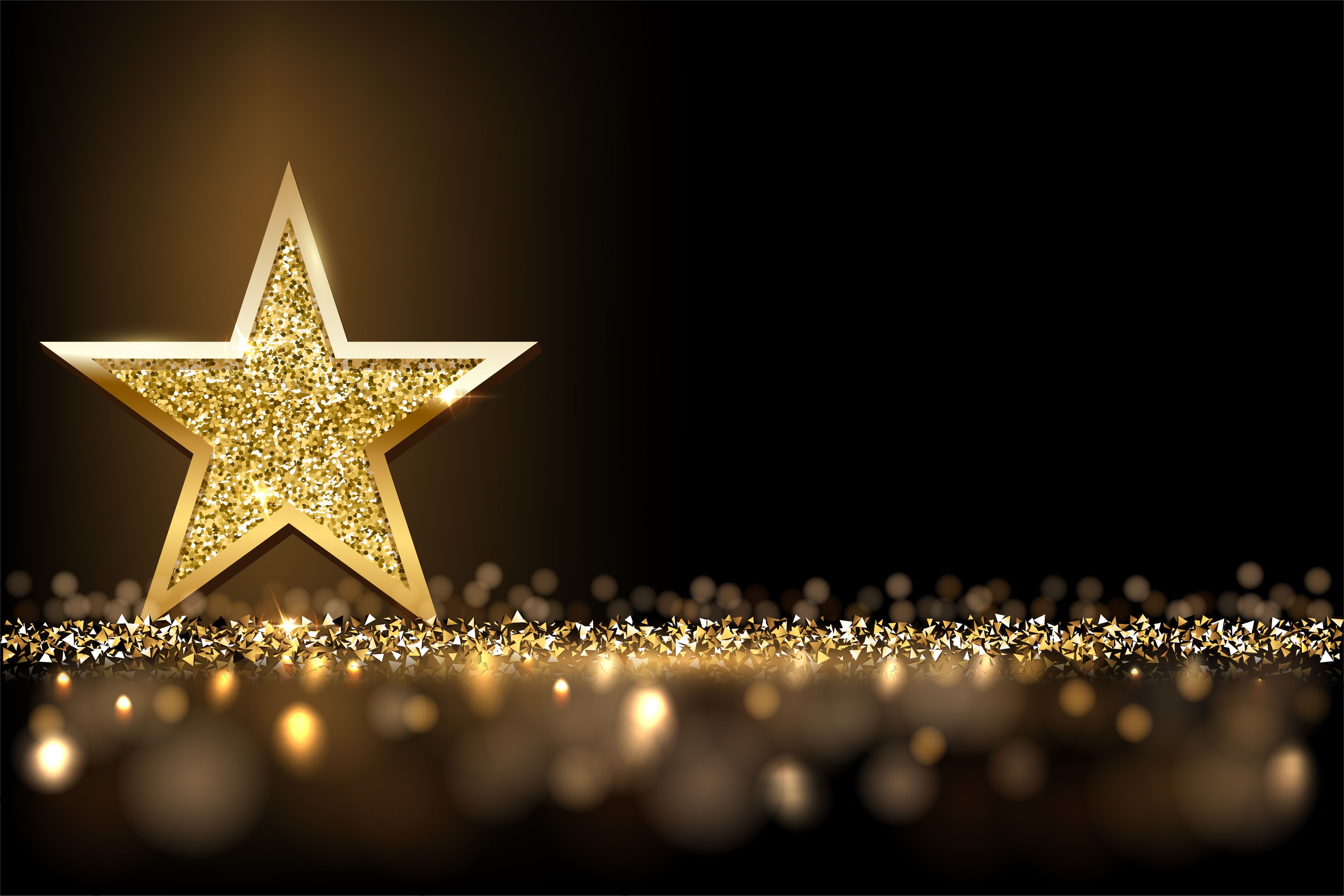 Golden star with shimmering light below it