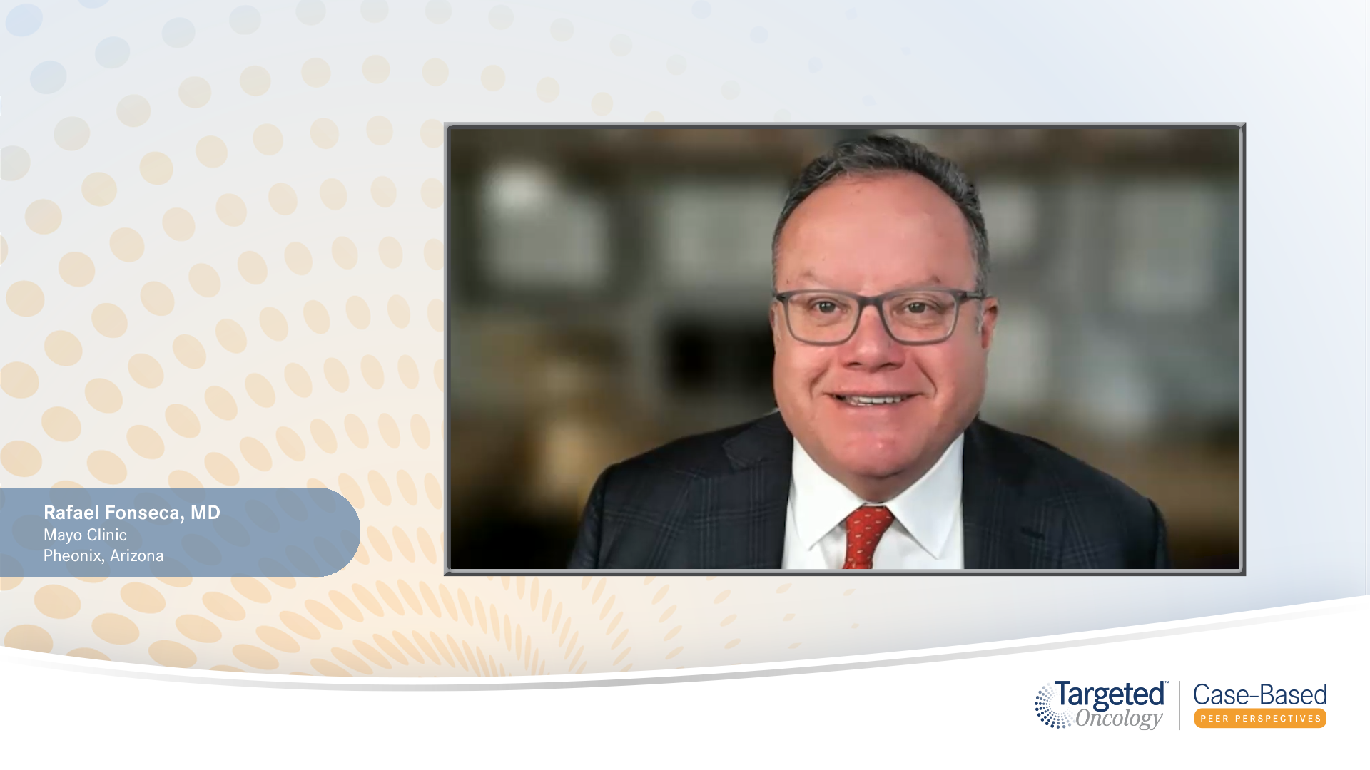 Rafael Fonseca, MD, smiles at the camera on a white-and-yellow background.