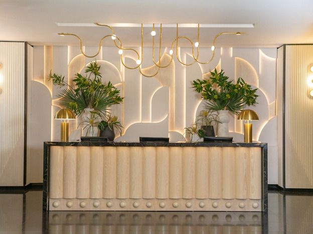 Lounge with velvet banquettes and woven pendant lights