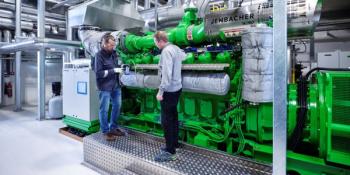 Operators standing by Jenbacher engine | Image Credit: INNIO Group