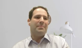 Colin Goudelocke, MD, answers a question during a Zoom video interview