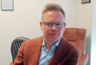 Marc Bjurlin, DO, MSc, FACOS, answers a question during a Zoom video interview