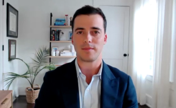 Benjamin Pockros, MD, MBA, answers a question during a Zoom video interview