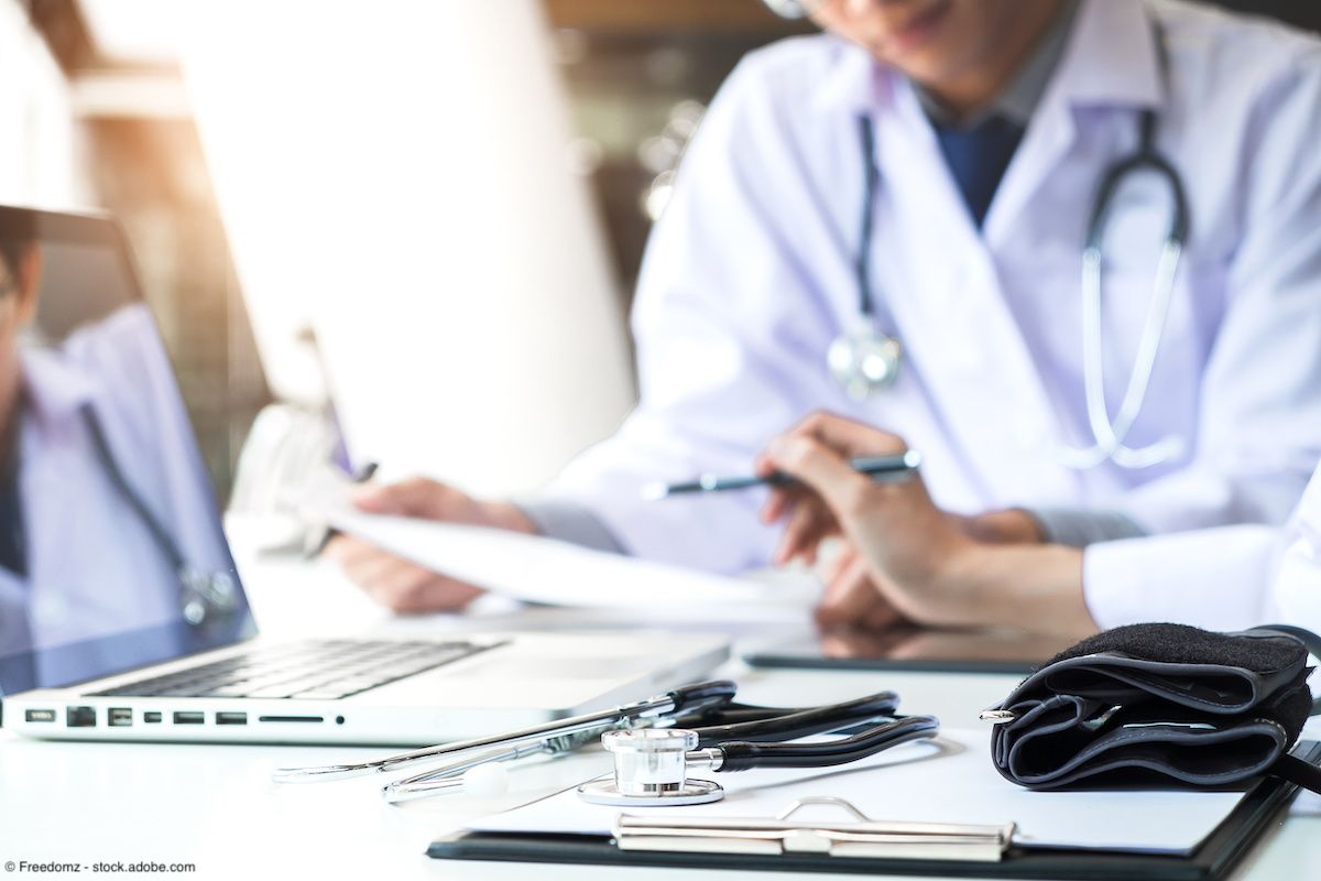 Two doctors being discussing patient history | Image Credit: © Freedomz - stock.adobe.com