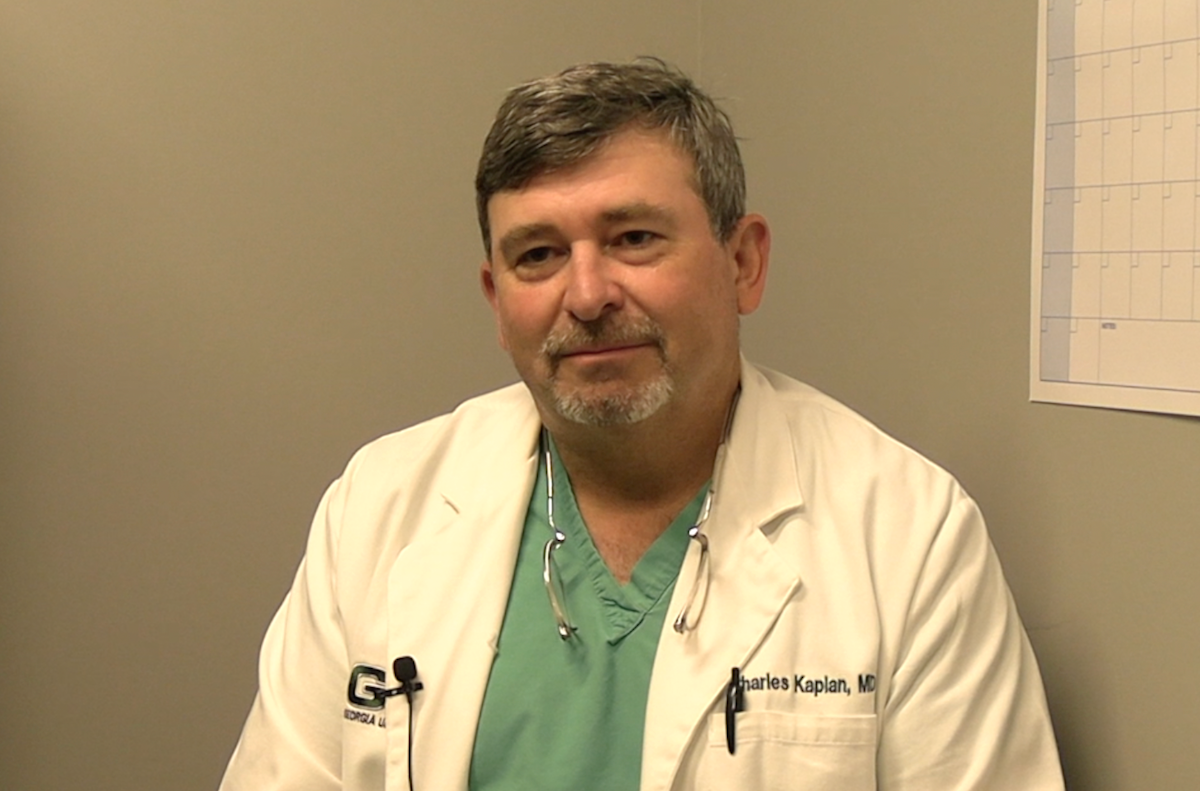 Charles Kaplan, MD, answers a question during a video interview