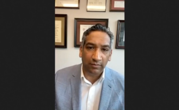 Sandip M. Prasad, MD, MPhil, answers a question during a Zoom video interview