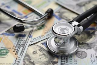 Medical stethoscope and dollar bills | Image Credit: © Kuzmick - stock.adobe.com