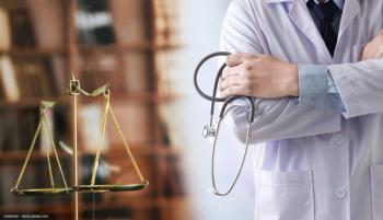 set of scales next a doctor with their arms folded, holding a stethoscope