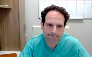 Colin Goudelocke, MD, answers a question during a Zoom video interview