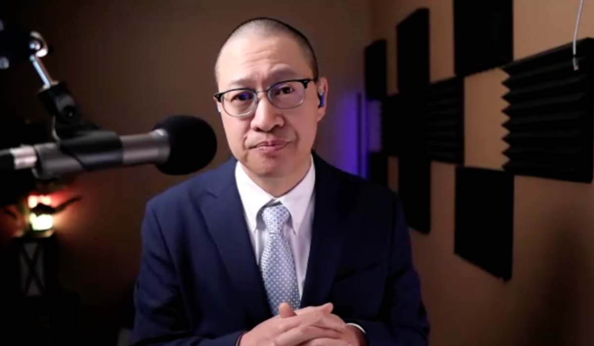 Wayne Kuang, MD, answers a question during a Zoom video interview