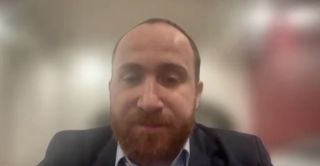 Mohamad Baker Berjaoui, MD, answers a question during a Zoom video interview