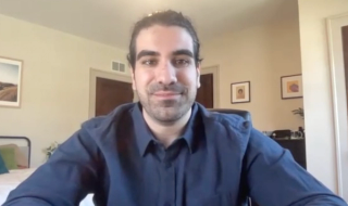 Matthew Loria answers a question during a Zoom video interview