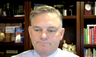 Andrew C. Peterson, MD, MPH, answers a question during a Zoom video interview