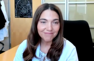 Andrea B. Apolo, MD, answers a question during a Zoom video interview