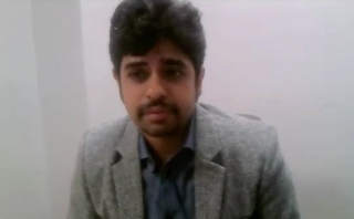 Jitesh Dhingra, MD, FRCEM, answers a question during a Zoom video interview