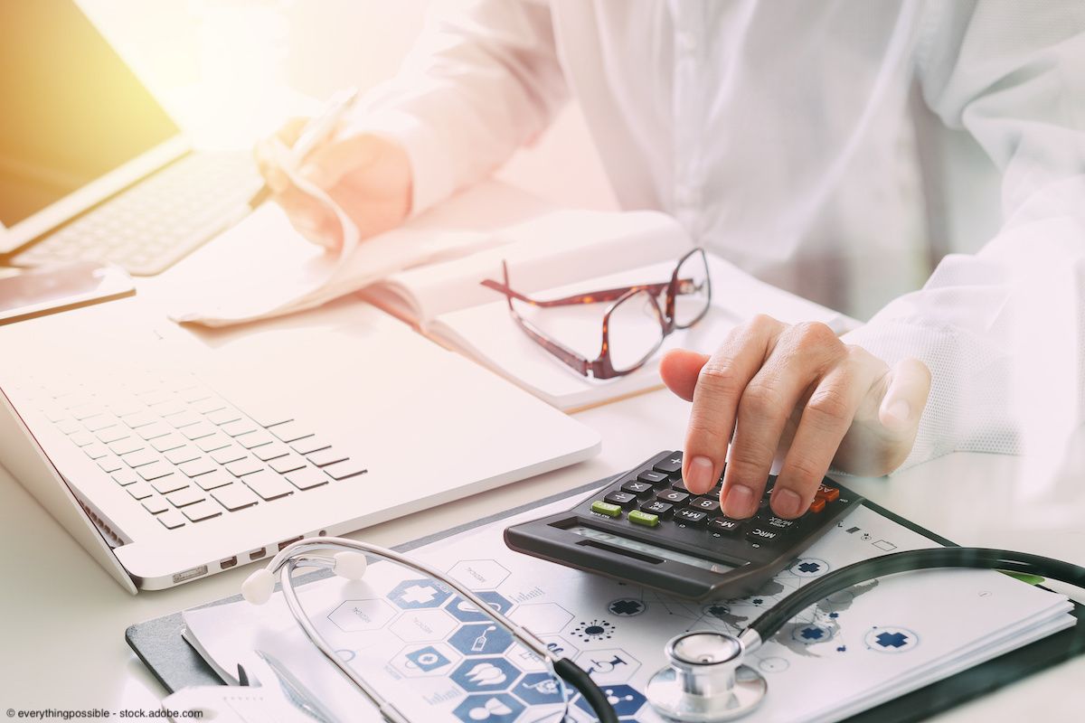 Doctor using calculator | Image Credit: © everythingpossible - stock.adobe.com