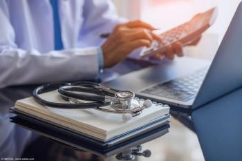 Female doctor or practitioner using calculator and work on laptop computer with medical stethoscope and notebook on the desk at clinic or hospital | Image Credit: © NIKCOA - stock.adobe.com 