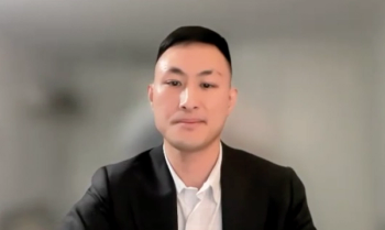 Raymond Xu, MD, answers a question during a Zoom video interview