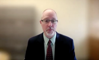 Colin P. West, MD, PhD, answers a question during a Zoom interview