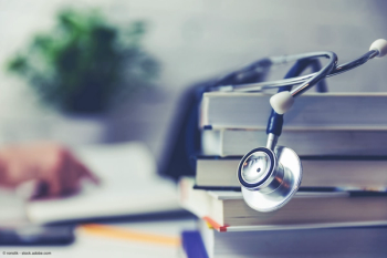 stethoscope sitting on a stack of books
