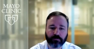 Derek J. Lomas, MD, PharmD, answers a question during a Zoom interview