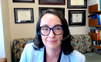 Sevann Helo, MD, answers a question during a Zoom video interview