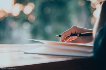 Woman writing in a notebook | Image Credit: © Baramee - stock.adobe.com
