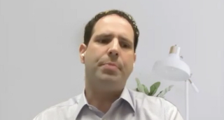 Colin Goudelocke, MD, answers a question during a Zoom video interview