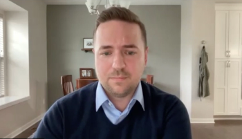 Daniel A. Triner, MD, PhD, answers a question during a Zoom video interview