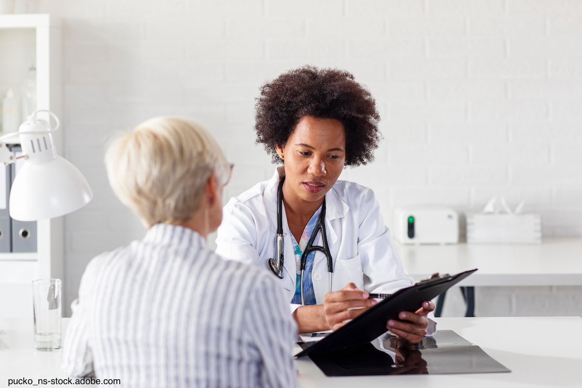 Woman speaking with her female doctor