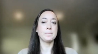 Lindsay A. Hampson, MD, MAS, answers a question during a Zoom video interview