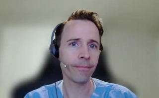 Landon Trost, MD, answers a question during a Zoom video interview