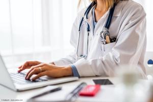 Female doctor with laptop working at the office desk | Image Credit: © Halfpoint - stock.adobe.com